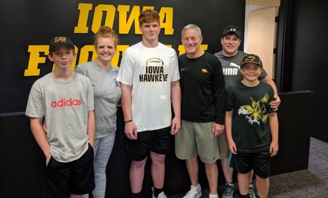 Class of 2021 offensive lineman Gennings Dunker and family with Iowa head coach Kirk Ferentz.