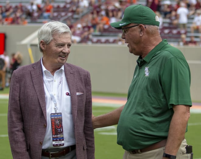 William & Mary coach Jimmye Laycock (right) talks with former Virginia Tech coach Frank Beamer before the Tribe fell to the Hokies during Laycock's last game in Blacksburg earlier this month.