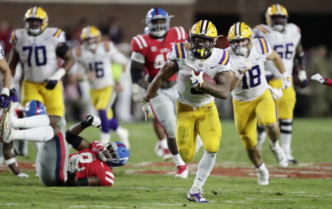 LSU running back Derrius Guice (5) runs on a long gain against Mississippi during the second half 