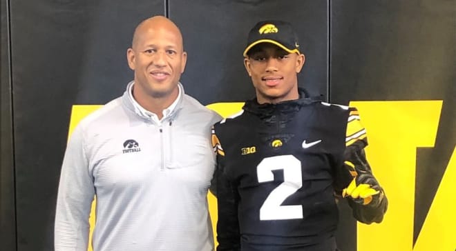 Iowa assistant coach LeVar Woods with four-star safety Antonio Johnson at the Hawkeyes' junior day.