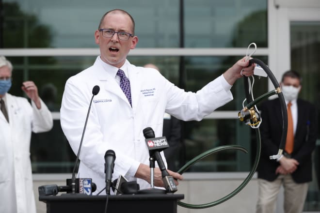 Dr. Charles Robertson, an assistant professor of anesthesiology at the University of Mississippi Medical Center demonstrates how the simple "last resort" ventilator he and a group of pediatric nurses and physicians designed and built, operates in Jackson, Miss., Tuesday, April 7, 2020. The group has built and tested 170 Robertson Ventilators made of items such as tubing, garden hose, and a digital timer found at local hardware stores. The medical school hopes to fast track approval by the U.S. Food and Drug Administration so they can be put into use should they be needed.