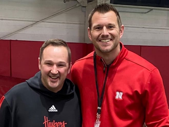 Vince Guinta poses with former Husker Zach Potter at a practice this spring. 