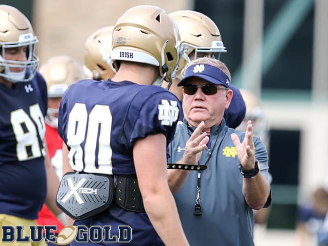 Notre Dame Fighting Irish football head coach Brian Kelly and freshman tight end Cane Berrong