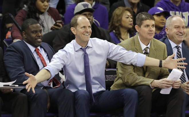 Washington Huskies men's basketball head coach Mike Hopkins (center), with assistant coaches Cameron Dollar (left) and Dave Rice (right). 