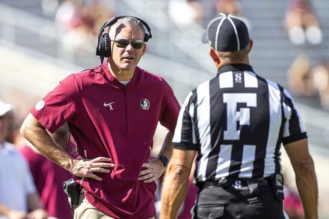 Florida State football coach Mike Norvell appears befuddled when speaking with an official this season.