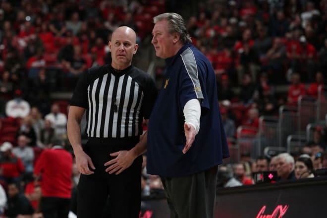 Huggins wants to see the Big 12 use a plan to alleviate travel concerns for West Virginia.