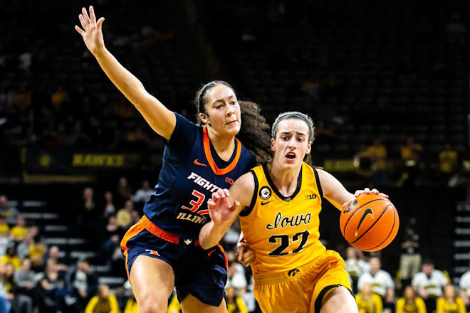 Iowa guard Caitlin Clark (22) drives against Illinois guard Aaliyah Nye (32) during a NCAA Big Ten Conference women's basketball game, Sunday, Jan. 23, 2022, at Carver-Hawkeye Arena in Iowa City, Iowa.