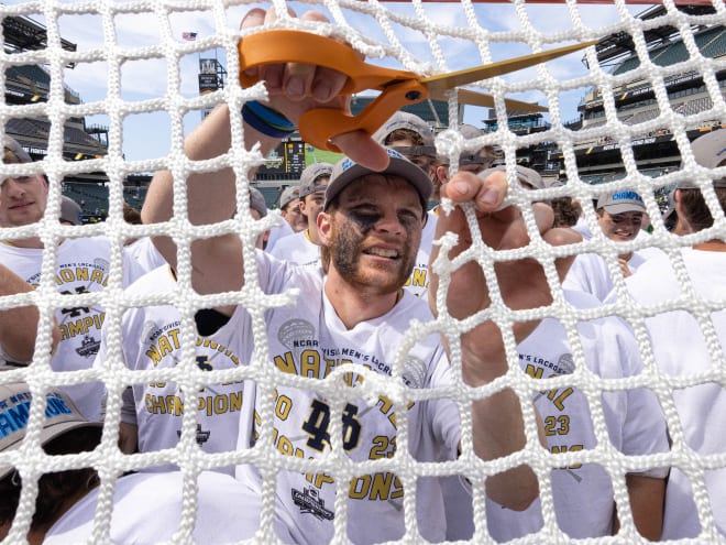 Chris Kavanagh cuts the net after Notre Dame men's lacrosse won the national championship Monday.