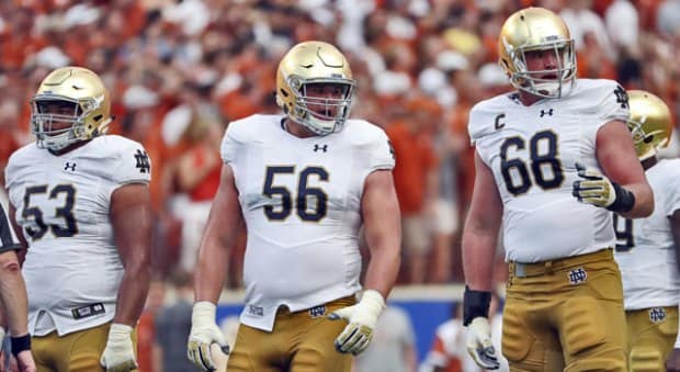 Tackle Mike McGlinchey (68), guard Quenton Nelson (56) and center Sam Mustipher (53) are three of the four returning starters along the line.