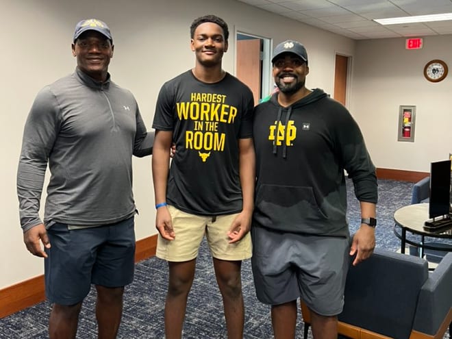 Former Notre Dame defensive lineman Bryant Young, left, poses with son, Bryce, a 2024 recruit, and Notre Dame defensive line coach Al Washington.