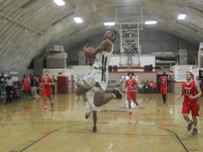 First Love Christian Academy wing D.J. Gordon goes up to finish in transition.