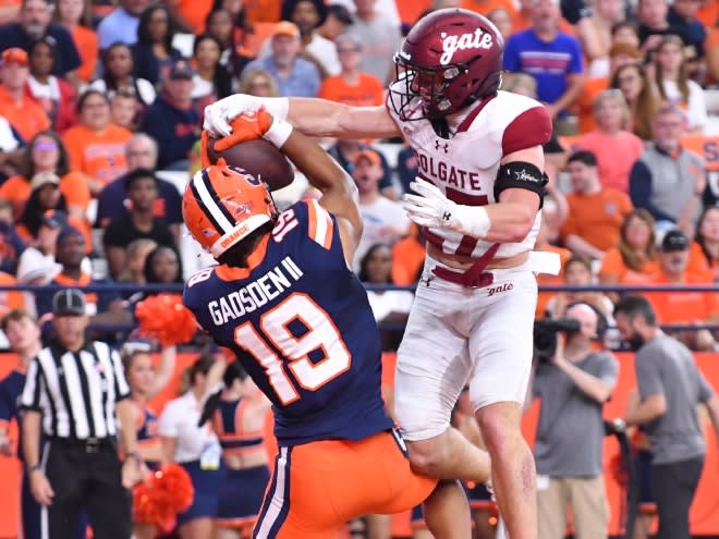 Sep 2, 2023; Syracuse, New York, USA; Syracuse Orange tight end Oronde Gadsden II (19) catches a touchdown as Colgate Raiders defensive back Owen Goss (27) defends in the second quarter at the JMA Wireless Dome. Mandatory Credit: Mark Konezny-USA TODAY Sports