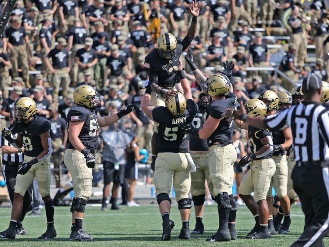 QB Tyhier Tyler had a 3-touchdown rushing day for the Black Knights