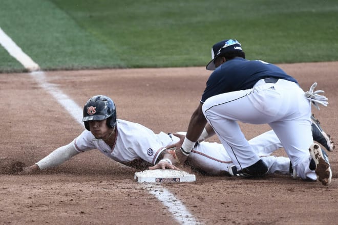 Holland had two of Auburn's 10 hits against the Yellow Jackets.