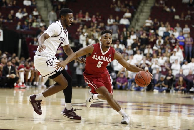 Avery Johnson Jr. drives to the basket during the Crimson Tide's game against Texas A&M on Saturday, Feb. 25 at College Station, Texas.