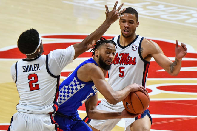 Kentucky's Davion Mintz was trapped by Devontae Shuler and KJ Buffen of Ole Miss.