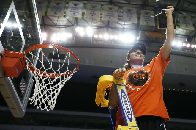 Deven Hunter cuts down the net after Oregon State advances to its first ever Final Four