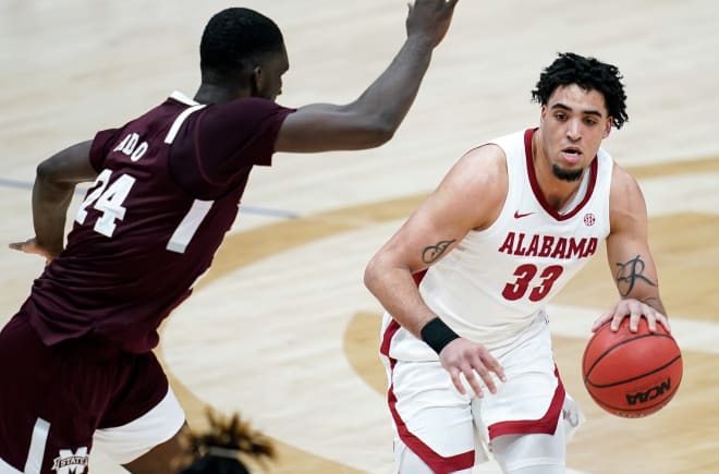 Alabama forward James Rojas (33) moves past Mississippi State forward Abdul Ado (24) during the second half of the SEC Men's Basketball Tournament game at Bridgestone Arena in Nashville, Tenn. Photo | USA Today