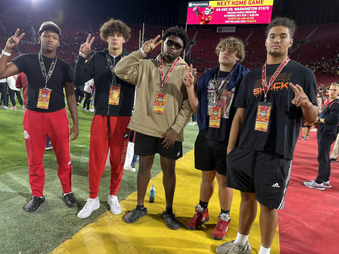 Top-35 edge rusher Matayo Uiagalelei (right) made it out to USC's game Saturday for his latest visit with the Trojans.