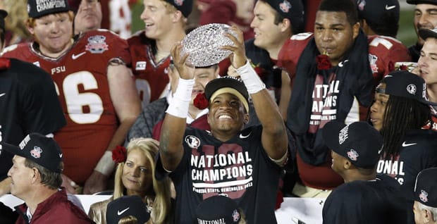 Jameis Winston holds up the national championship trophy after the 2013 season.