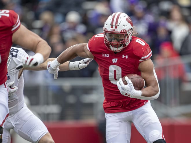 During his career at Wisconsin John Chenal rushed for 228 and five  touchdowns