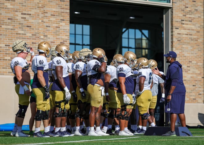 Notre Dame second-year defensive line coach Al Washington (right) has a pivotal spring ahead of him.