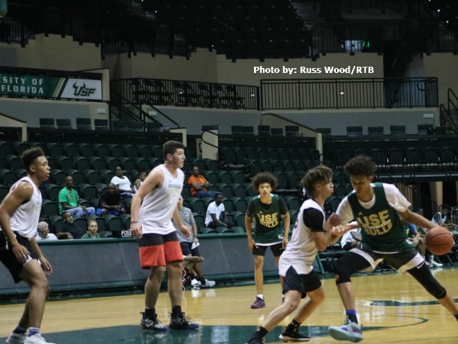 Class of 2021forward Lynn Kidd dribbles against a smaller defender at the USF Elite Camp.