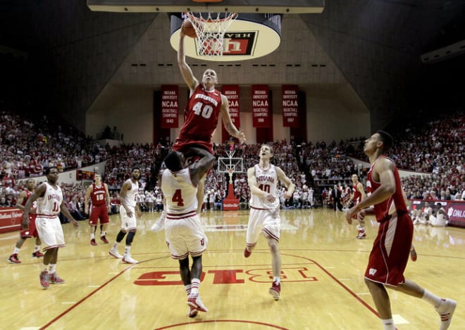 Wisconsin's Jared Berggren (40) goes in for a dunk against Indiana's Victor Oladipo (4) in 2013. The Badgers beat No.2 Indiana, 64-59, for their fifth straight win at Assembly Hall.