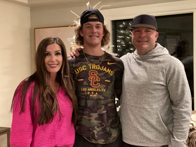 USC freshman QB Jaxson Dart with his parents Kara and Brandon back home in Utah in early January.
