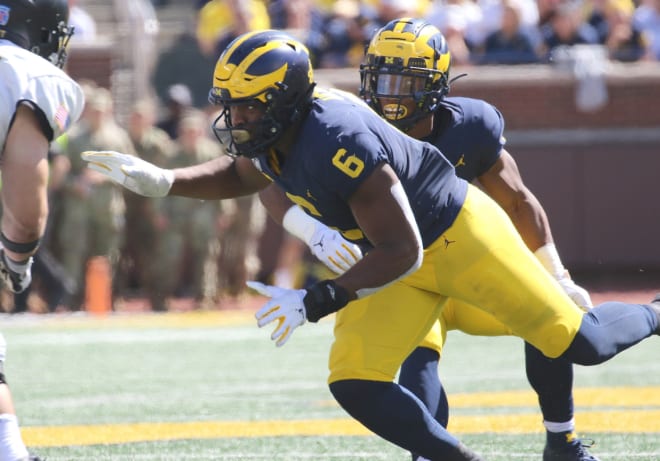 Michigan linebacker Josh Uche signed a big deal with New England as a second round pick.