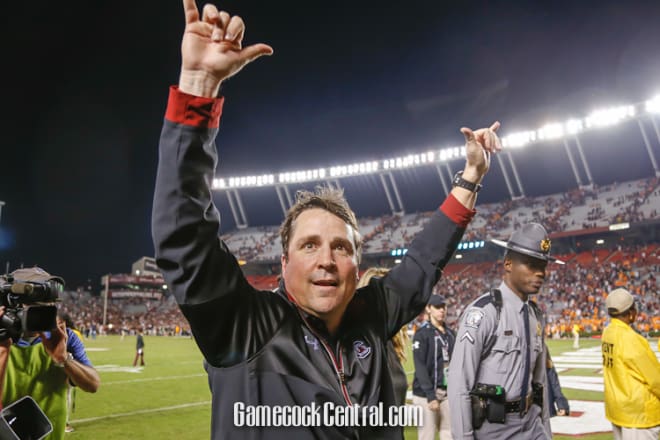 USC head coach Will Muschamp gives a double "Spurs Up" to the crowd following the Gamecocks' 24-21 win over 18th-ranked Tennessee Saturday night at Williams-Brice Stadium.