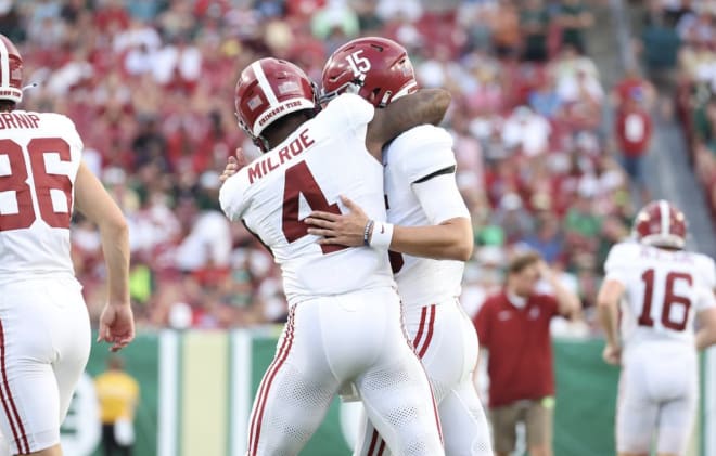 Jalen Milroe hugs fellow Alabama quarterback Ty Simpson following a scoring drive against South Florida. Photo | Alabama Athletics 