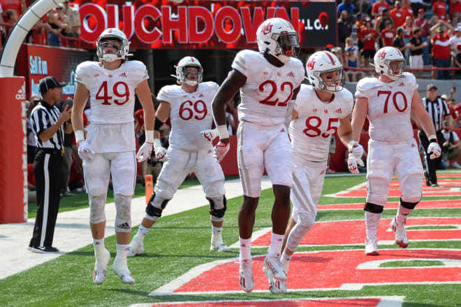 Nebraska tight end Nate Boerkircher (No. 49) celebrates a touchdown with his teammates