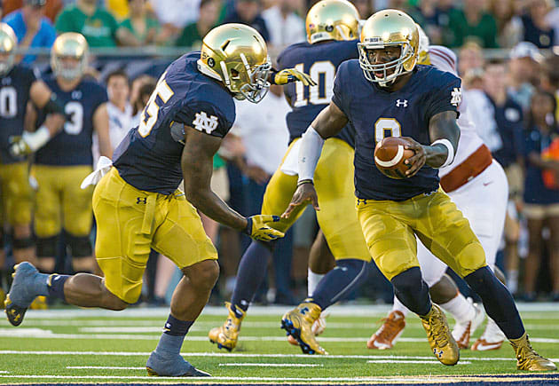 Notre Dame Fighting Irish football quarterback Malik Zaire (No. 8) and Tarean Folston (No. 25)