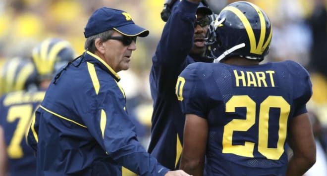 Lloyd Carr (left) and Mike Hart (right)
