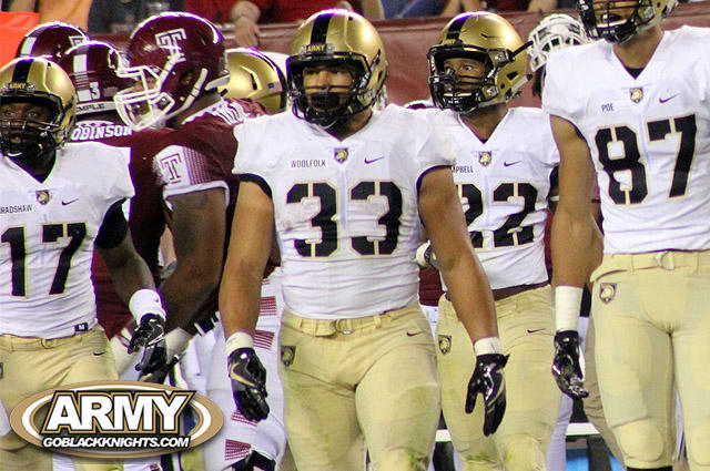 Senior fullback Darnell Woolfolk leads the pack of Army fullbacks