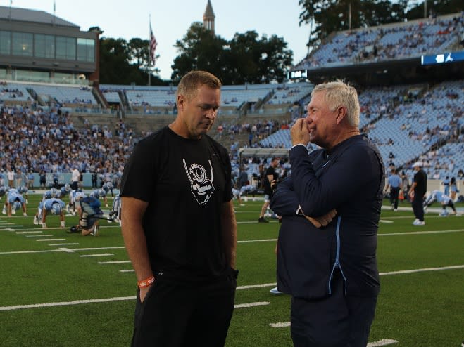 UNC Coach Mack Brown (right) said Wednesday he is not happy with the ACC's response to questionable hits versus UVA.