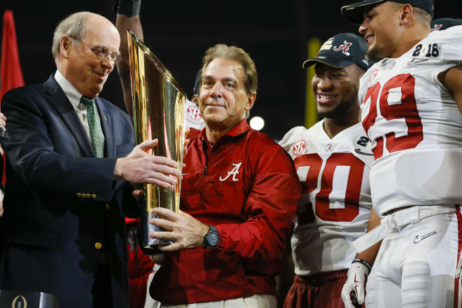 Alabama Crimson Tide head coach Nick Saban receives the CFP trophy during the trophy presentation at the conclusion of the College Football Playoff National Championship Game between the Alabama Crimson Tide and the Georgia Bulldogs on January 8, 2018 at Mercedes-Benz Stadium in Atlanta. Photo | Getty Images 