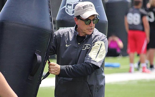 Kevin Wolthausen, a quality control assistant, helps run a football camp in June at Purdue. 