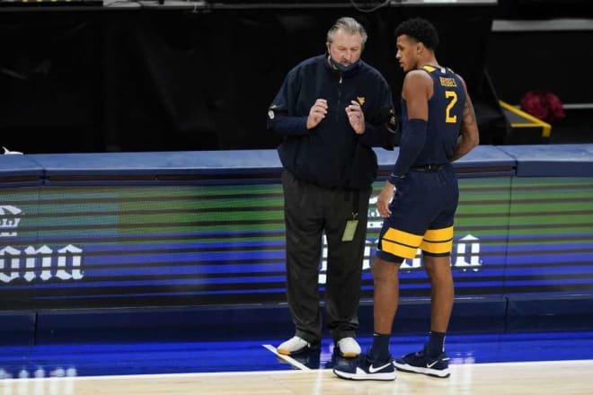 West Virginia Mountaineers basketball coach Bob Huggins sees benefits to safely staying the course.