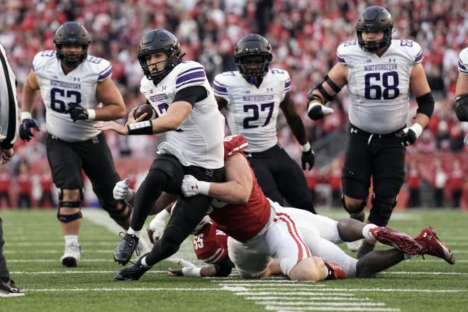 Nov 11, 2023; Madison, Wisconsin, USA; Northwestern Wildcats quarterback Ben Bryant (2) rushes with the football during the second quarter against the Wisconsin Badgers at Camp Randall Stadium. Mandatory Credit: Jeff Hanisch-USA TODAY Sports