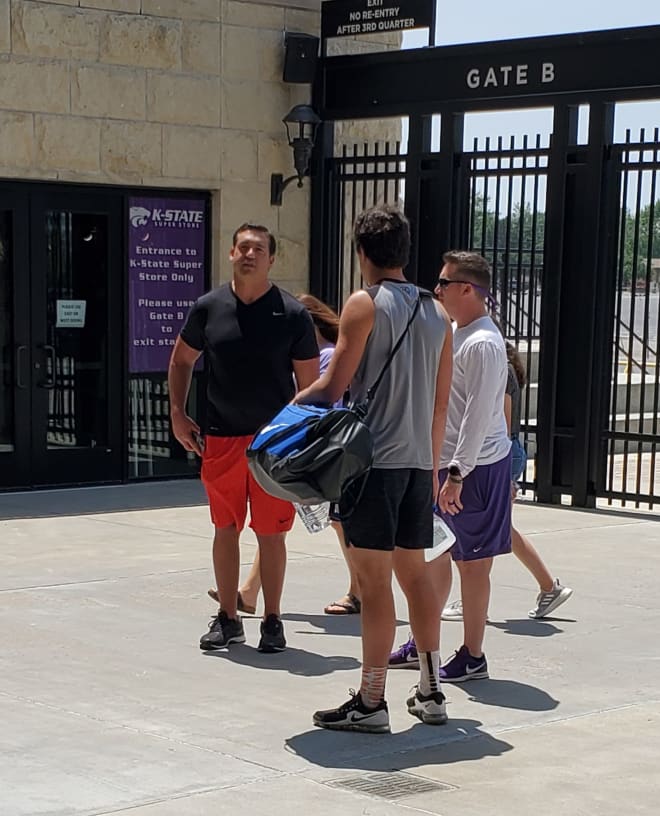Austin Weiner is shown between his father, Todd, and K-State's Taylor Braet.