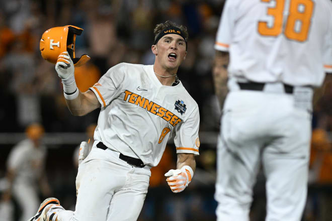 Jun 14, 2024; Omaha, NE, USA; Tennessee Volunteers left fielder Dylan Dreiling (8) singles in the winning run against the Florida State Seminoles during the ninth inning at Charles Schwab Filed Omaha. Mandatory Credit: Steven Branscombe-USA TODAY Sports