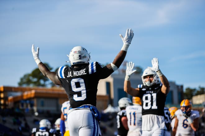 Duke's Jaquez Moore, left, and Nicky Dalmolin celebrate during the regular-season finale against Pitt. 