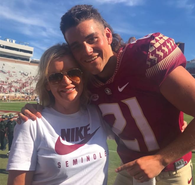 Kathryn Mastromanno is all smiles before watching her son Alex punt against UMass in October. It was her first live college football game.