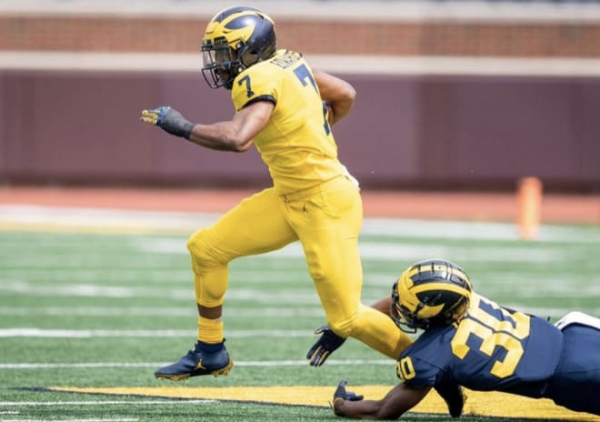 Michigan Wolverines football running back Donovan Edwards is coached by Mike Hart