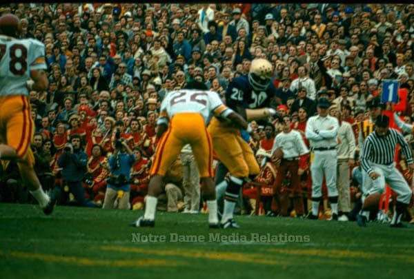 Freshman Luther Bradley removes the helmet from All-America senior Lynn Swann in the famous upset of USC in 1973.