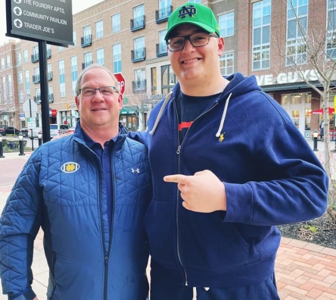 Notre Dame offensive line coach Harry HIestand (left) and four-star prospect Sam Pendleton during a recent recruiting visit by Pendleton and his family.