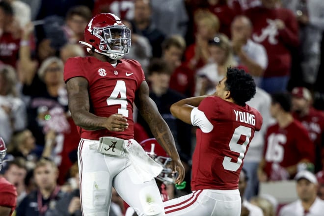 Alabama Crimson Tide quarterback Jalen Milroe (4) celebrates with quarterback Bryce Young (9) after throwing a touchdown pass against the Texas A&M Aggies during the first half at Bryant-Denny Stadium. Photo | Butch Dill-USA TODAY Sports