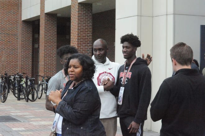 LB Demouy Kennedy chats with FSU assistant coach Raymond Woodie at Junior Day.